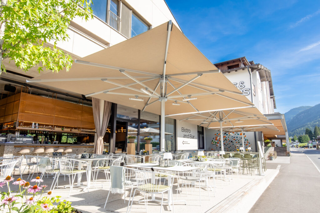 Home Large-scale commercial umbrella for restaurant patio shading and wind-resistant outdoor dining.